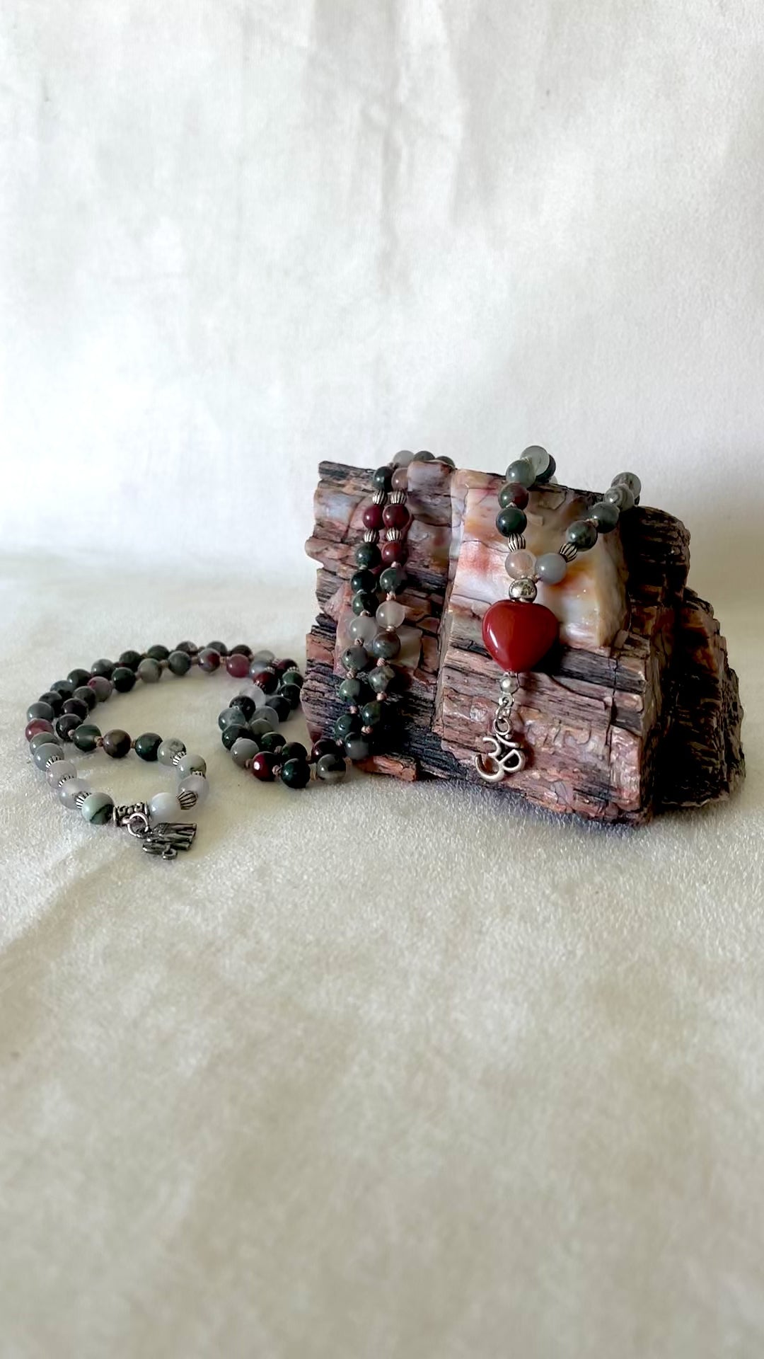 Video preview mini mala heliotrope red jasper, small elephant charm, om pendant, red jasper heart
