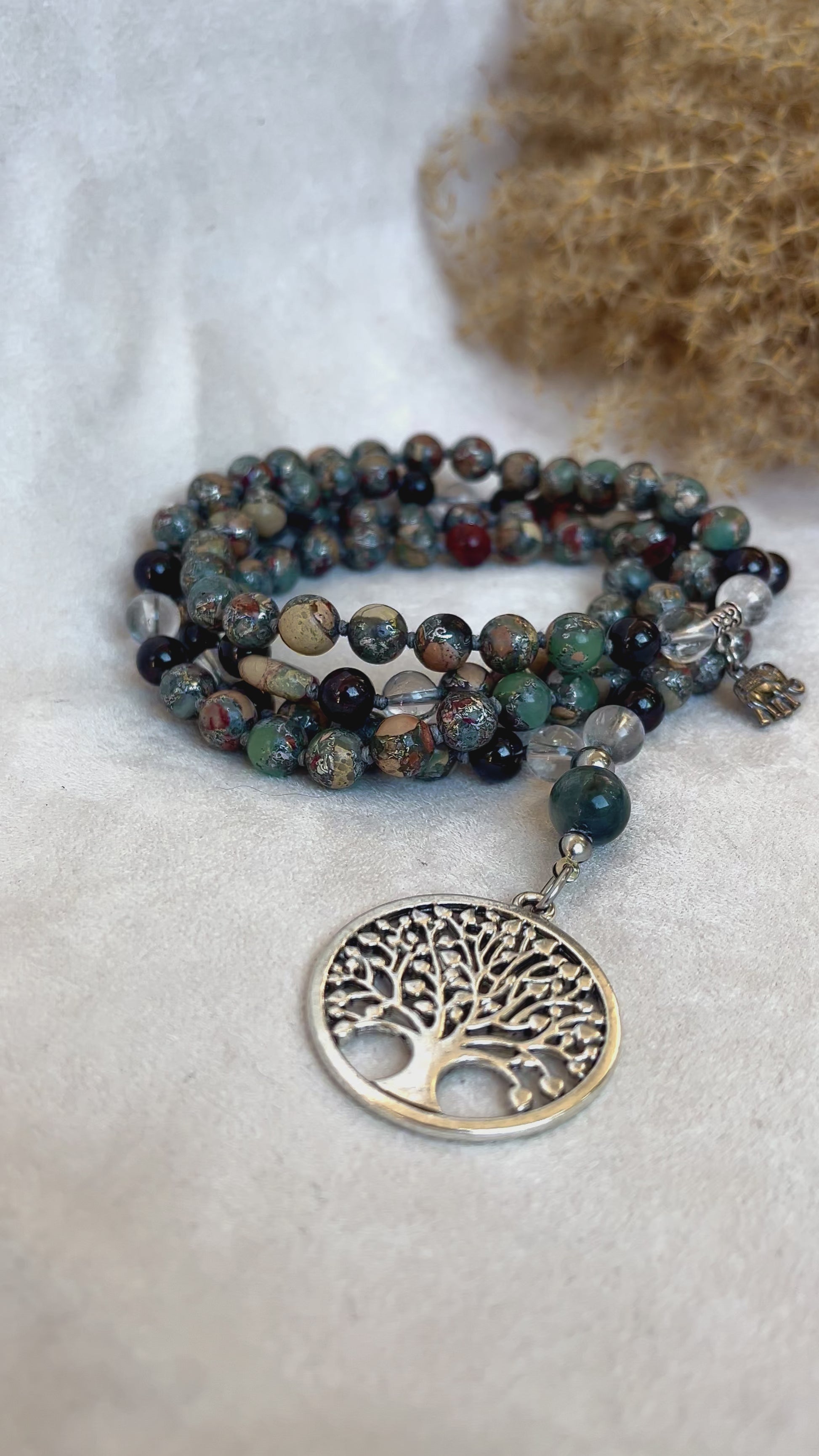 Video Full mala with 108 beads laid on natural background Mala 4 Elements: Aqua, Earth, Air, and Fire with tree of life pandant
