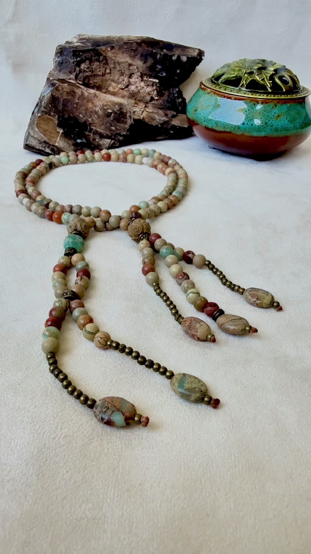 Video perview of Gemstone Juzu for Nichiren chanting Nam Myoho Renge Kyo. Handmade Buddhist prayer beads. Japanese-style Juzu with tassels and natural stones. Nichiren Buddhist necklace for chanting and spiritual focus.