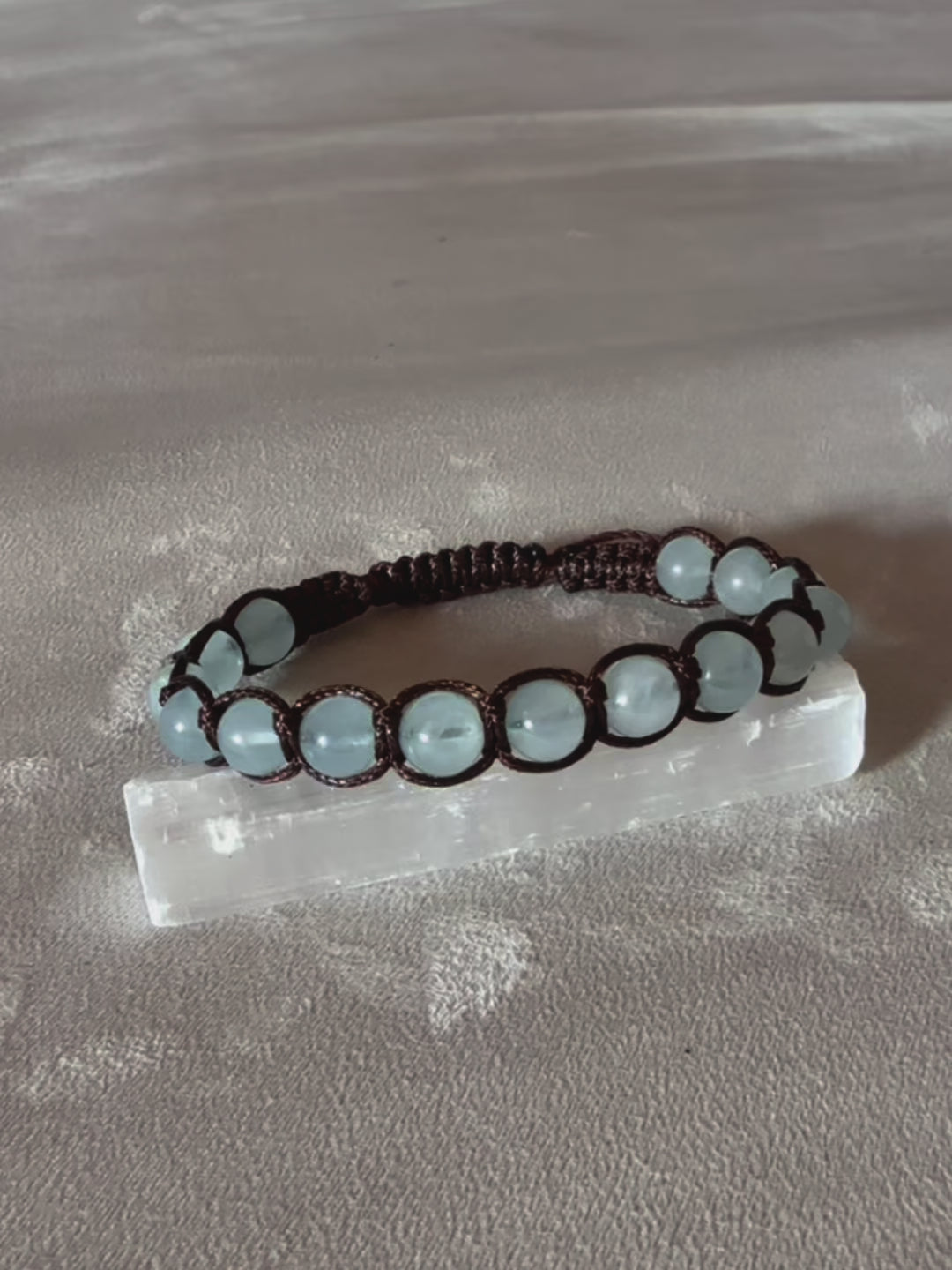 Video preview of Tibetan Tamashii- style Bracelet in Aquamarine - meditation bracelet for intention of balance and peace, mindful living. Clear blue beads Shamballa bracelet with spiritual natural gemstones.