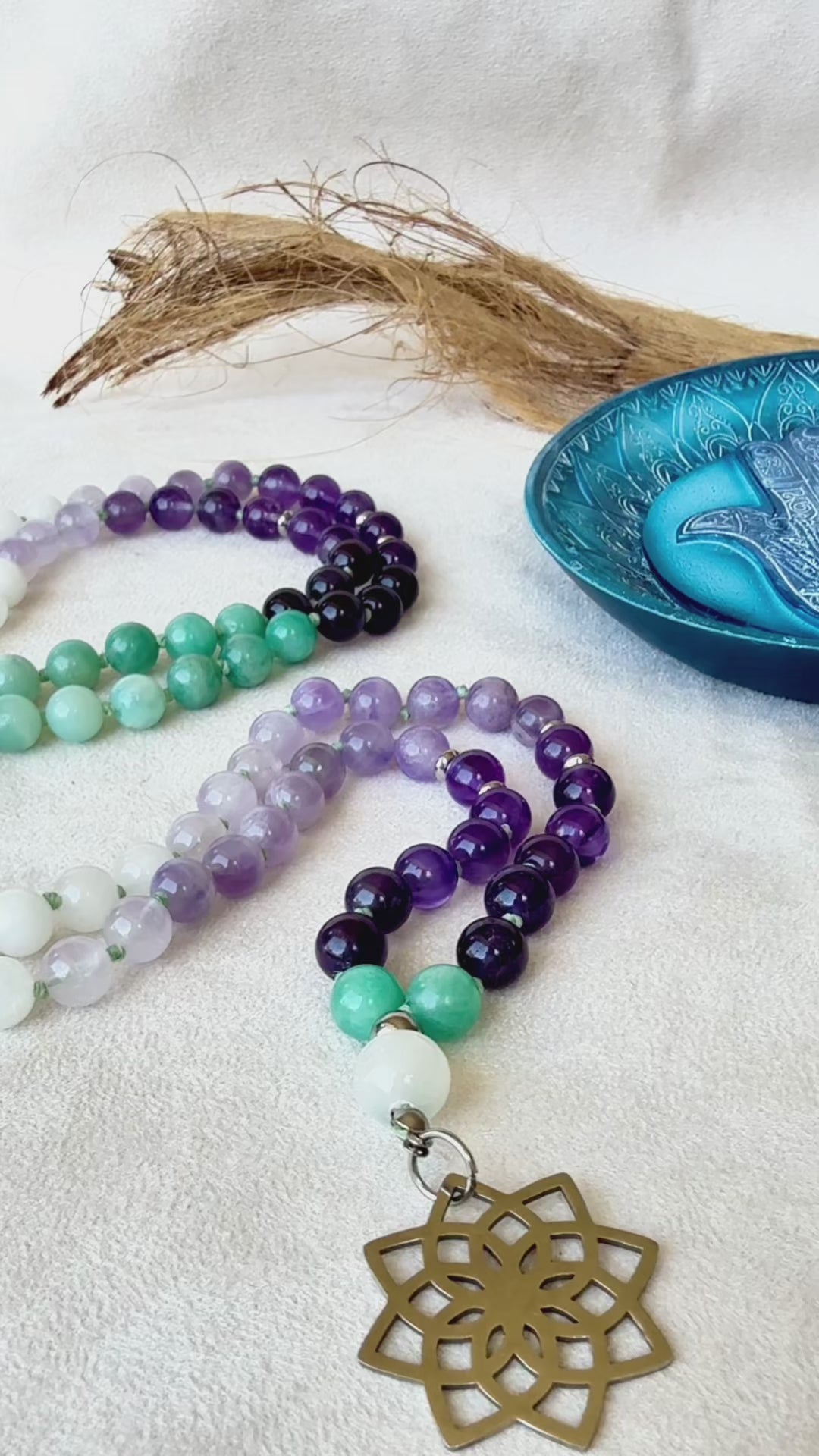 Video preview of Samdea Mala for letting go and emotional healing – 108 bead necklace with amethyst, amazonite and jade. Mala for Pisces Zodiac Sign. Buddha charm, seed of life pendant and lotus charm