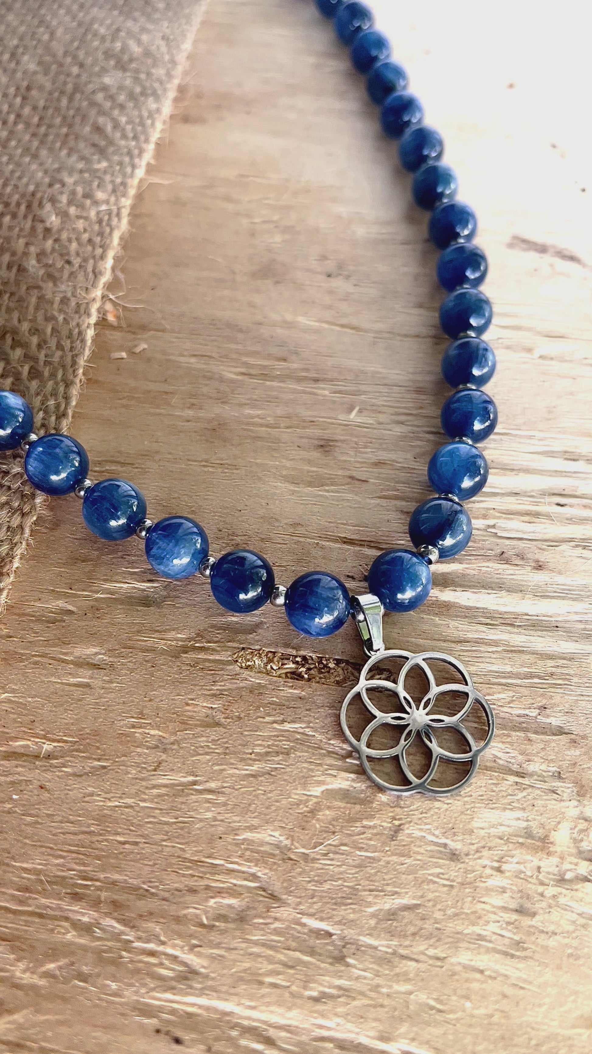 Close up necklace in Kyanite with seed of life pendant