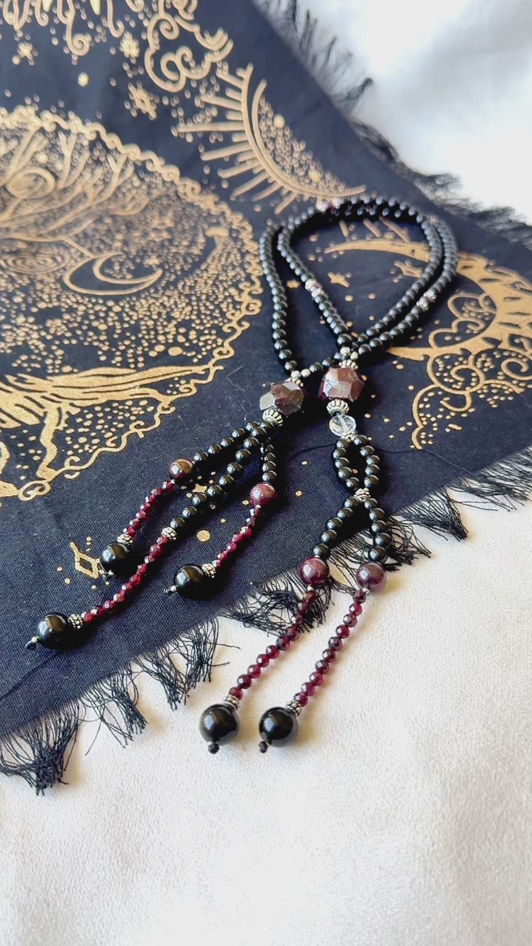 video preview of Obsidian and garnet juzu with clear quartz – a talisman of sacred protection, clarity, and devotion for your daily spiritual journey.