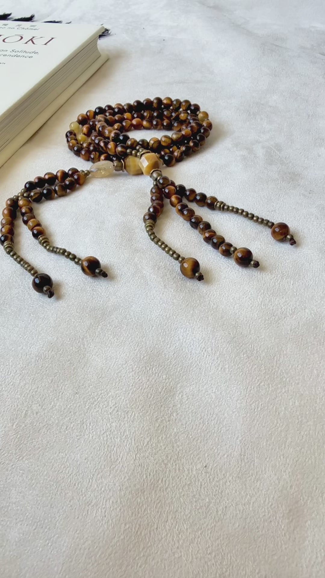 Video preview of Juzu – Japanese Buddhist Prayer Beads with Citrine Enlightenment Bead for Strength and Clarity. tiger eye juzu, citrine quartz, buddhist beads, japanese juzu, juzu for men, nichiren rosary, tiger eye mala, protection beads, clarity jewelry, chanting beads, spiritual gift, juzu bracelet, citrine healing, zen prayer beads, 108 juzu, enlightenment bead, grounding stone, sacred mantra, buddhist rosary, lotus sutra