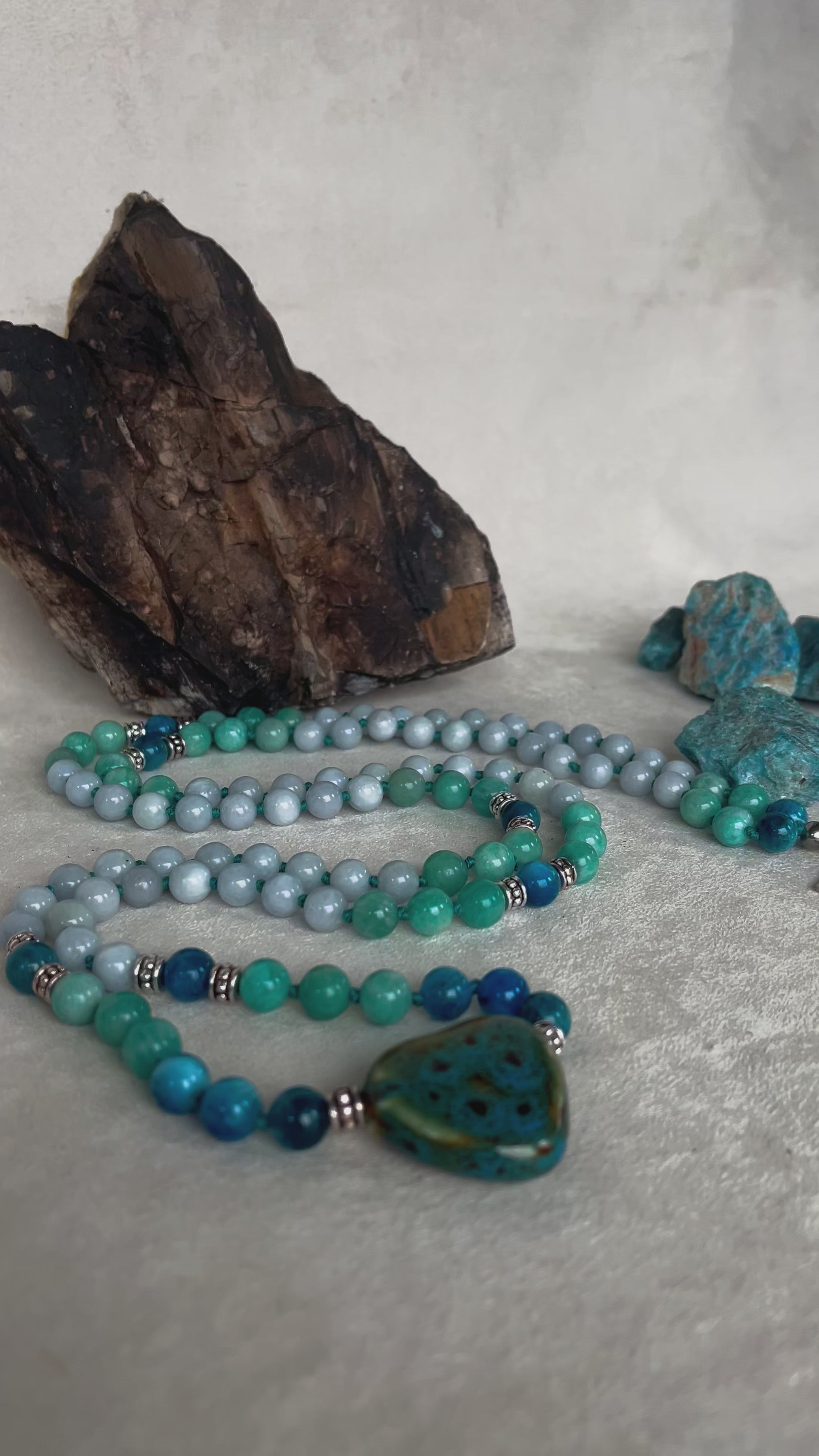 Video preview Mala for communication and inner clarity - apatite, aquamarine and amazonite with heart pendant with hamsa hand small charm