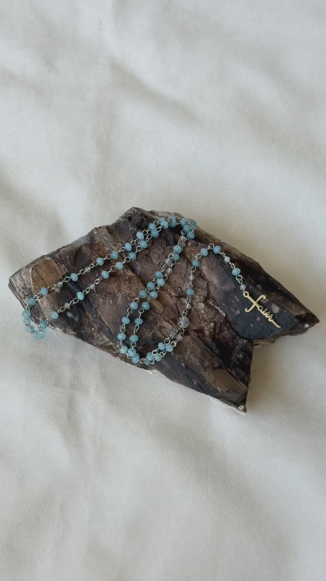 Video Preview of Roman Catholic Rosary with aquamarine and clear quartz. wearable rosary, rosary jewelry, rosary gift, spiritual jewelry, handmade rosary, crystal rosary, clear quartz, catholic beads, devotion gift, gemstone rosary.