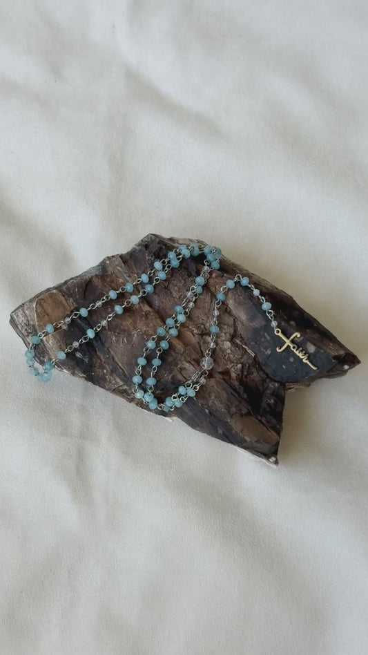 Video Preview of Roman Catholic Rosary with aquamarine and clear quartz. wearable rosary, rosary jewelry, rosary gift, spiritual jewelry, handmade rosary, crystal rosary, clear quartz, catholic beads, devotion gift, gemstone rosary.