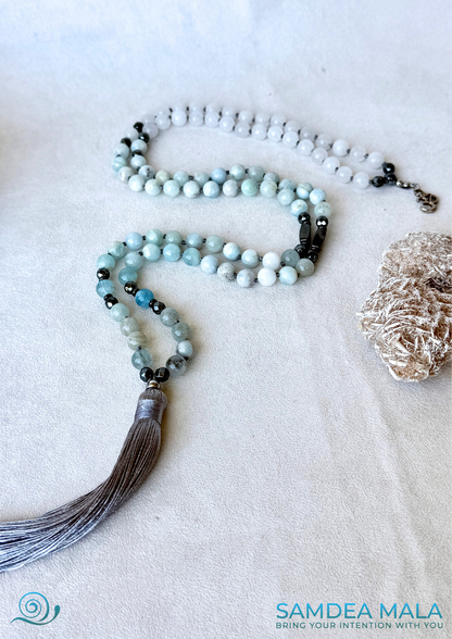 108 Mala beads for meditation in Aquamarine and White Jade with Tassel for peace and presence - OM charm