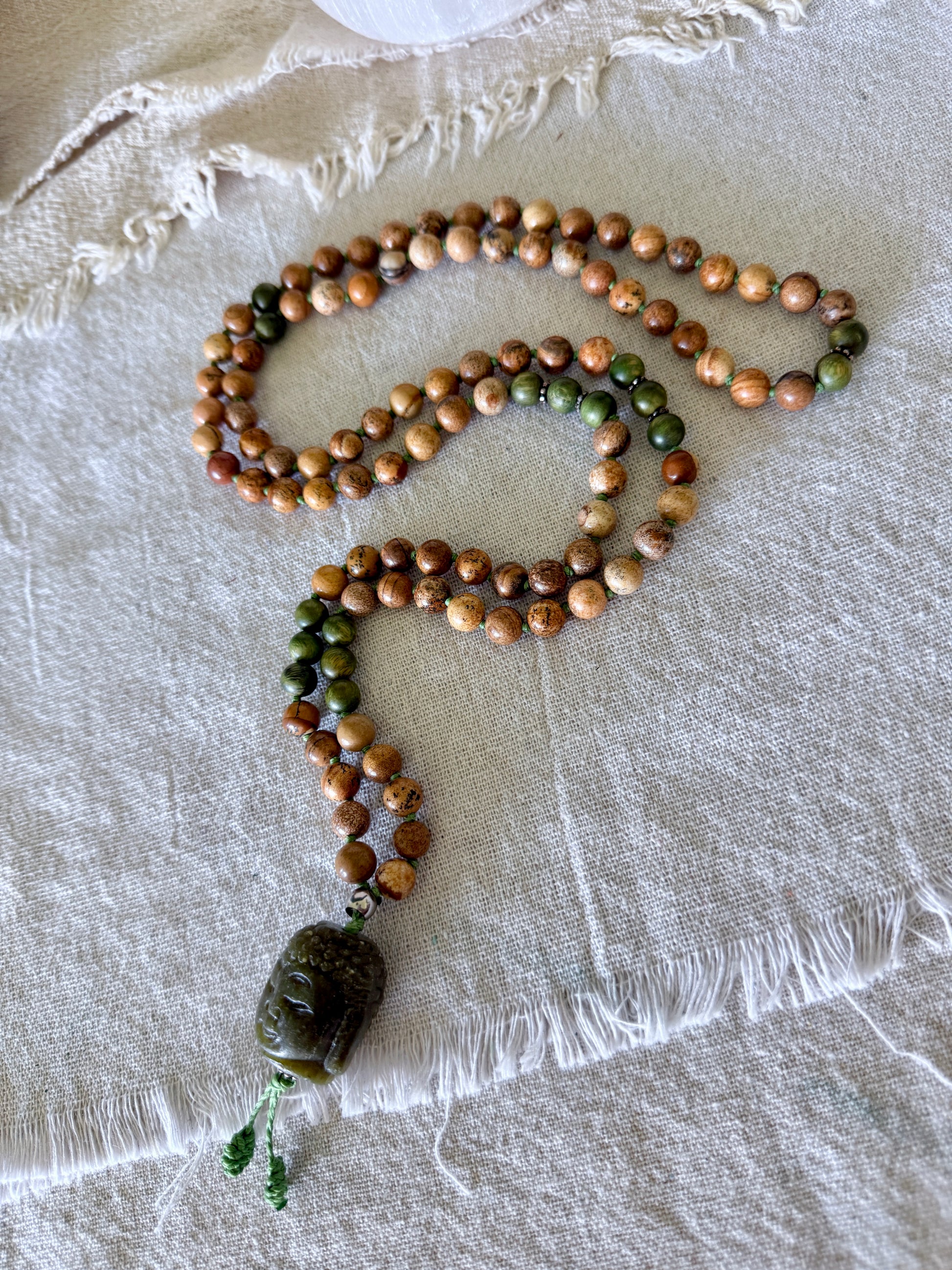 108 bead mala for meditation with genuine sandalwood, sand jasper gemstones, and Jade Buddha pendant