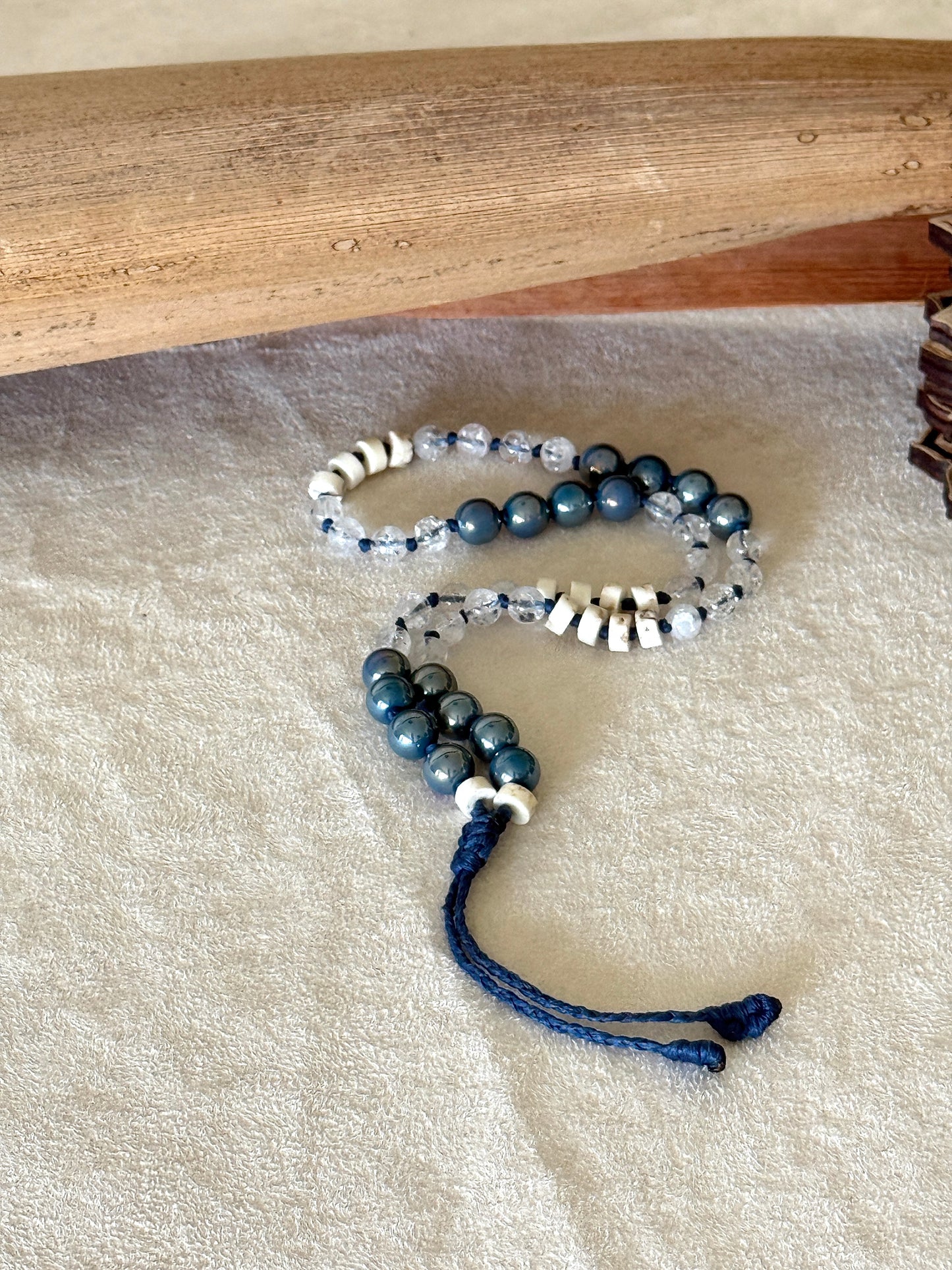 Aqua aura natural gemstone box breathing mala  bracelet with groups of four beads to guide inhale, hold, exhale, and hold during breathing practice. 