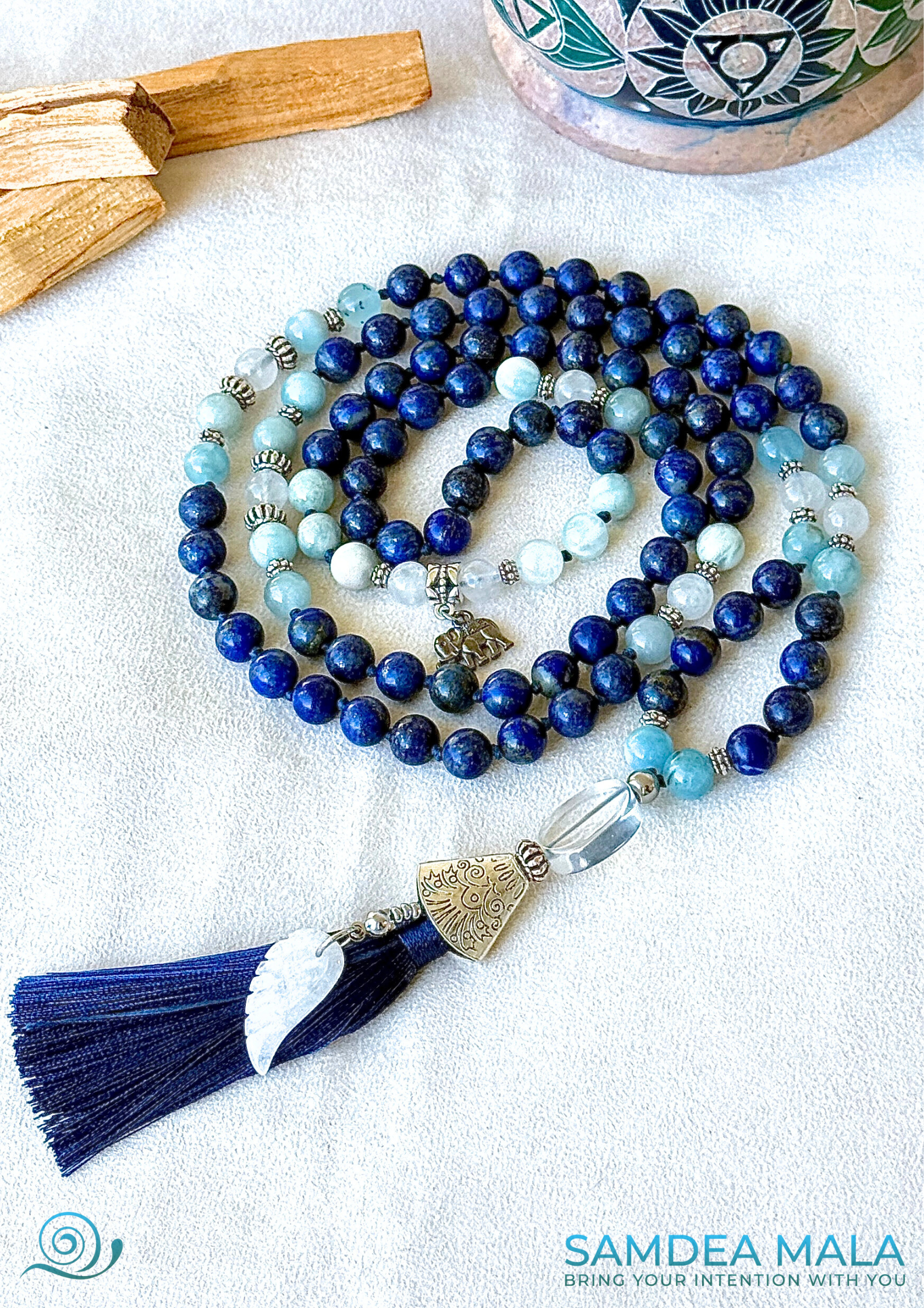 Aquamarine beads and lapis lazuli in the Blue Mala for meditation for Libra zodiac sign, promoting flow, acceptance, and gentle strength 