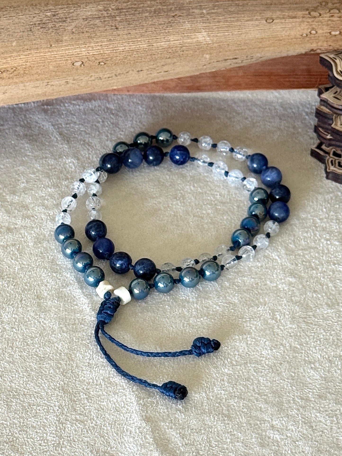 Natural gemstone box breathing mala  bracelet with groups of four beads to guide inhale, hold, exhale, and hold during breathing practice. 
