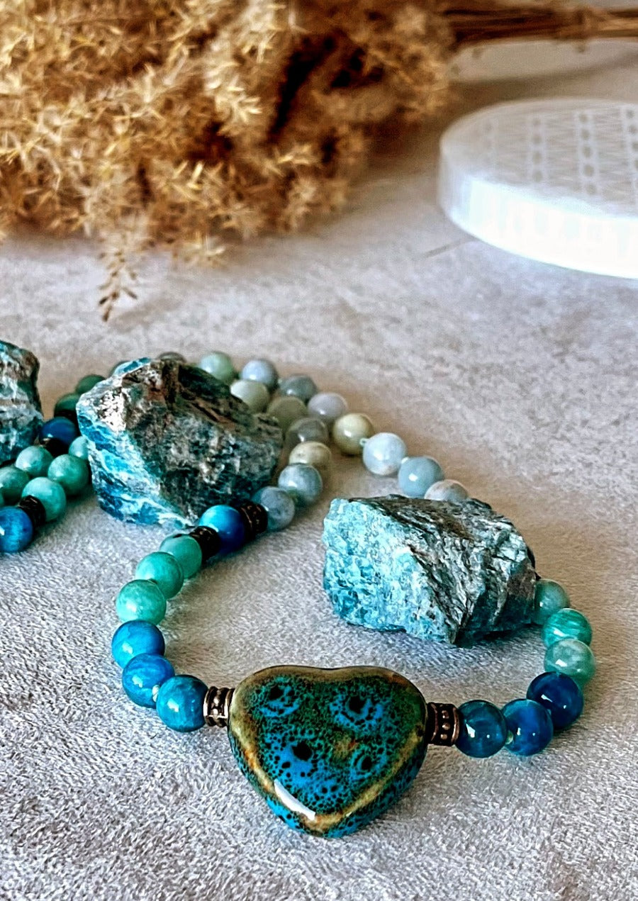 Close-up of a custom Guru Mala, natural gemstone beads and hand-knotting detail