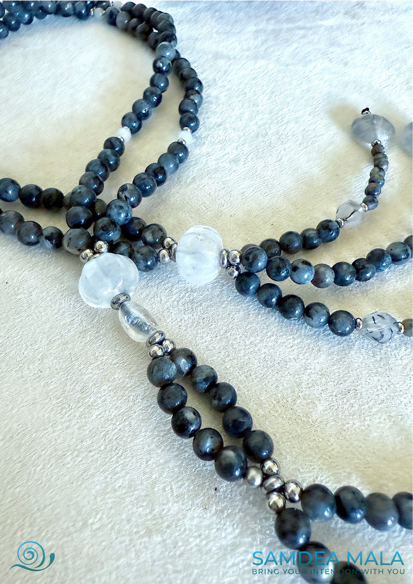 Close-up of grey larvikite beads with subtle flash on SGI Buddhist chanting juzu