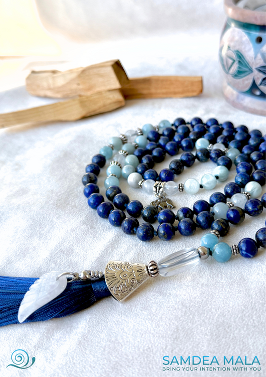 Close-up of lapis lazuli beads in the Mala for Libra zodiac sign, showing natural color and detailed knotting
