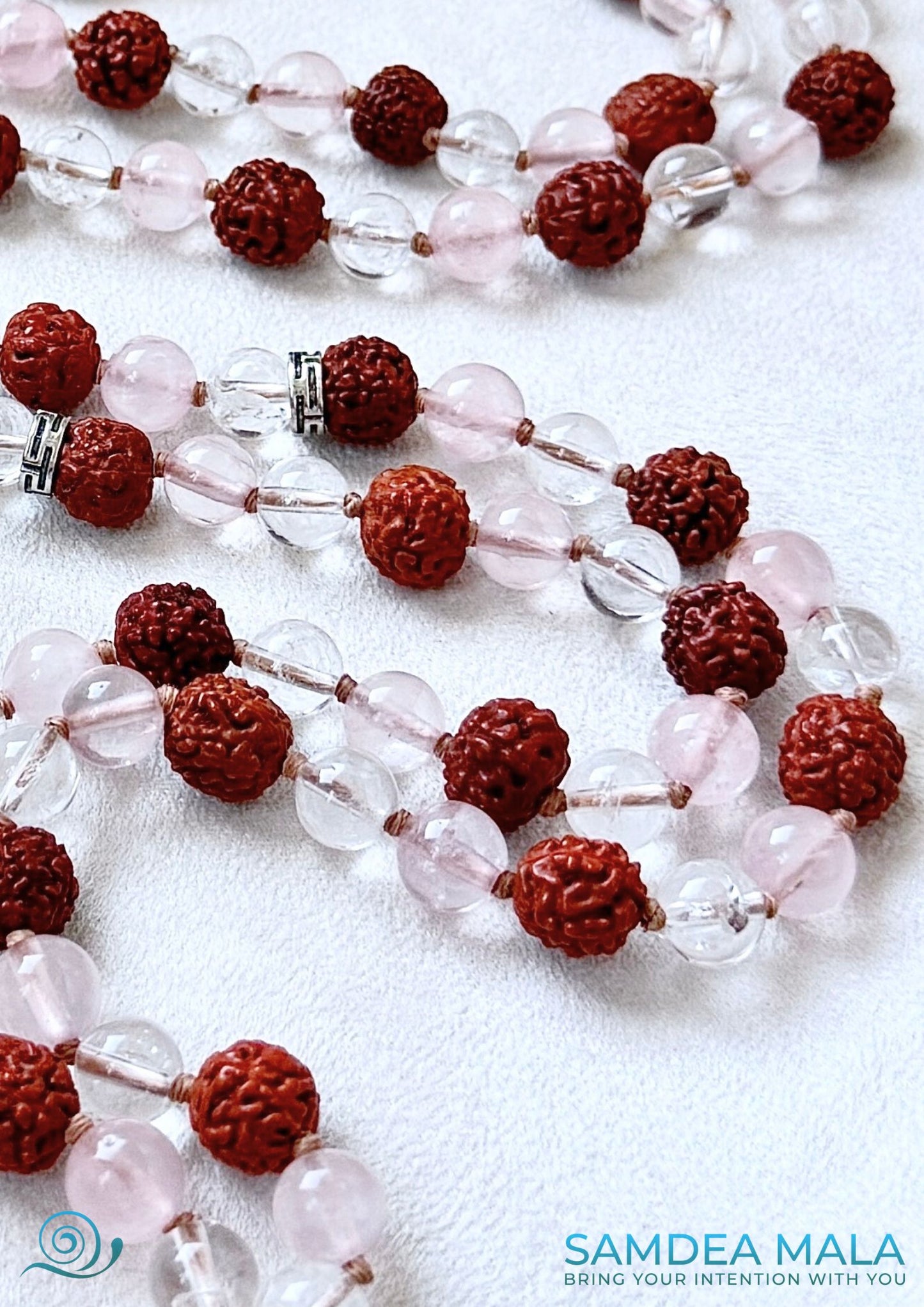 Detail of Hand knotted mala beads with rudraksha seeds and quartz gemstones