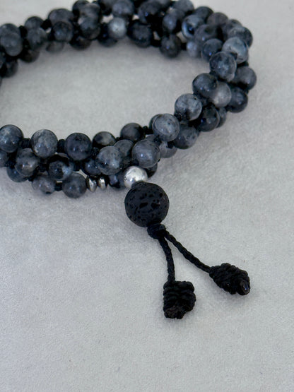 Mala for man. Detail of Natural grey larvikite mala necklace with 6 mm beads, lava stone meru, stainless steel Buddha charm and grounding spiritual jewelry by Samdea Mala