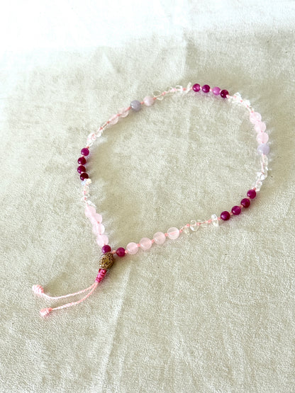 Fill view of Handmade  Square Breathing Mala with pink agate, rose quartz, clear quartz, and a rose-gold-colored stainless steel Buddha head meru, designed for box breathing, meditation, and mindful pauses.