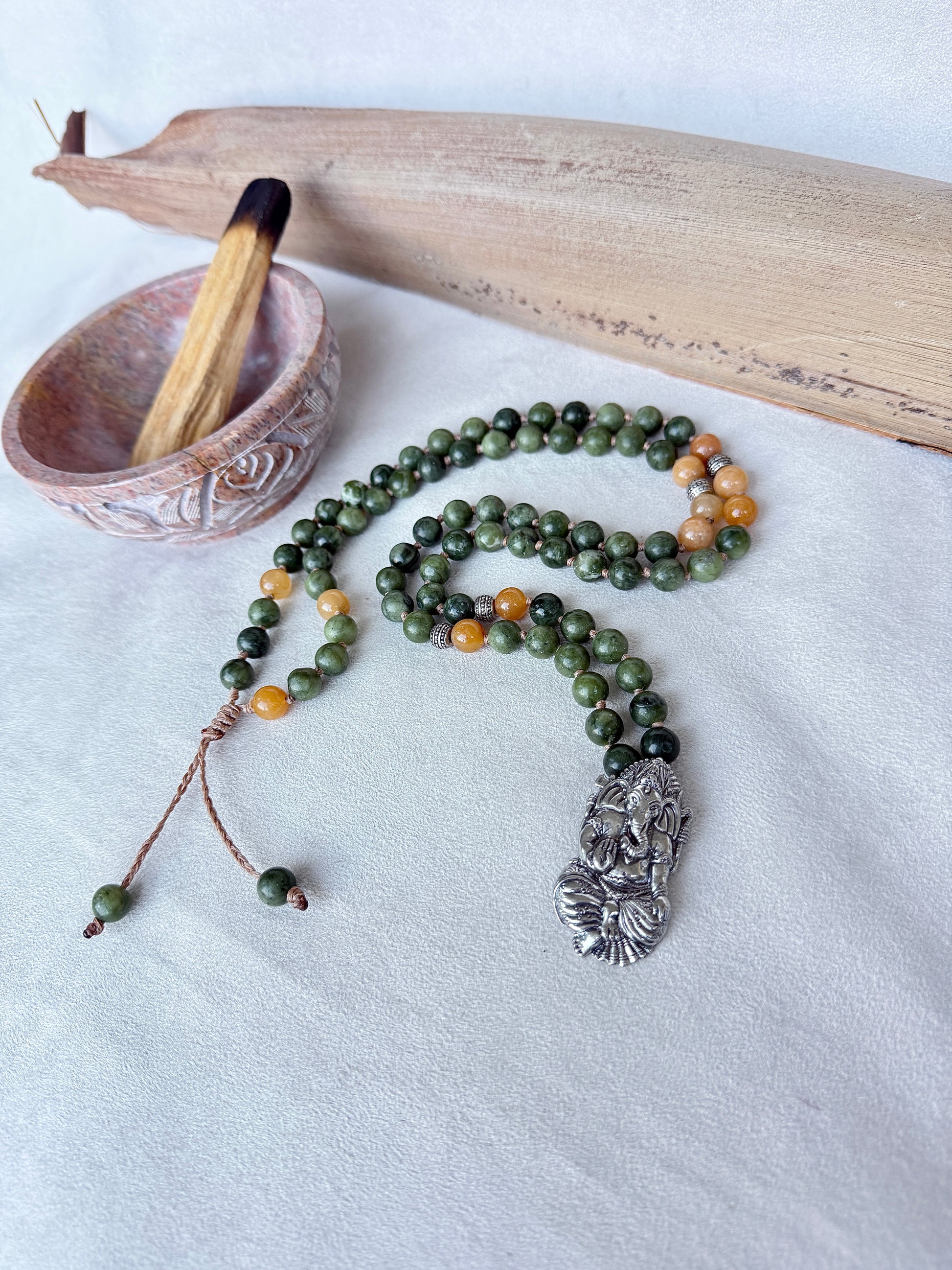 Short mala necklace coiled to show 31.5 inch length and balanced color pattern Ganesha pendant for abundance