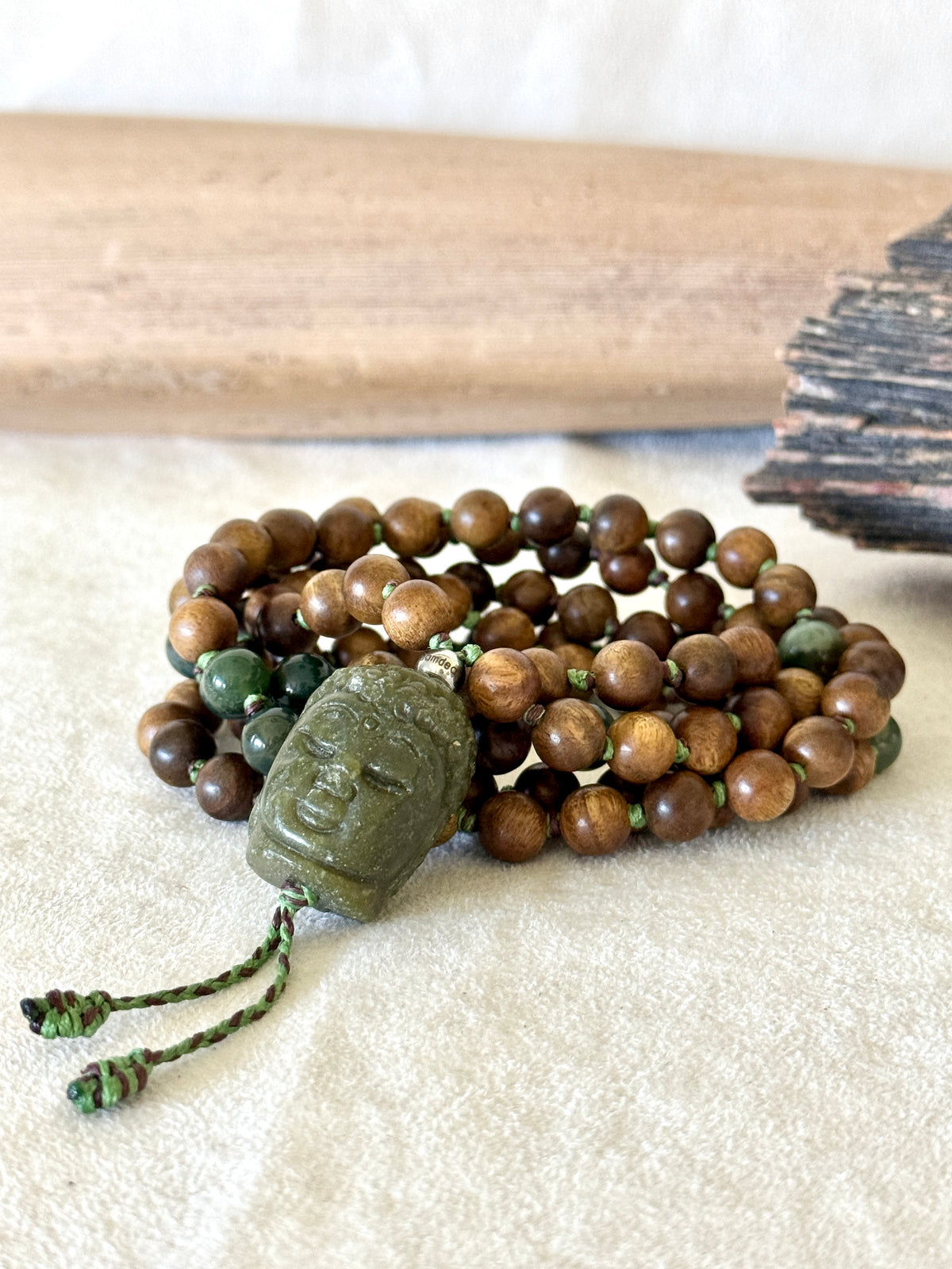 Samdea Mala sandalwood necklace with 108 hand-knotted beads, Indian agate, and a hand-carved jade Buddha pendant