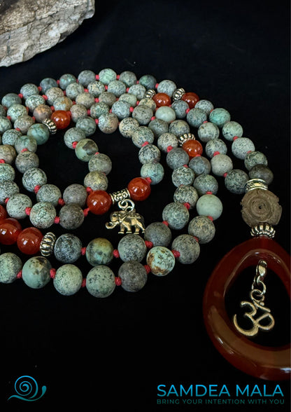 Samdea Mala close up of mala beads made with African turquoise and red agate, for energy and clarity, 108 mala beads with grounding colors and red tones.