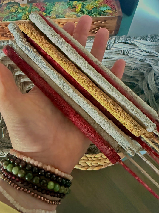 hand holding resin rolled incense sticks with Himalayan herbs and spices for a natural home ritual. Plant-based artisan incense sticks hand-rolled in India, natural non-toxic ingredients. Resin rolled incense stick texture detail showing herbal blend and artisan hand rolled Nag Champa tradition
grounding, presence, and a clean spiritual home ritual Samdea Mala 