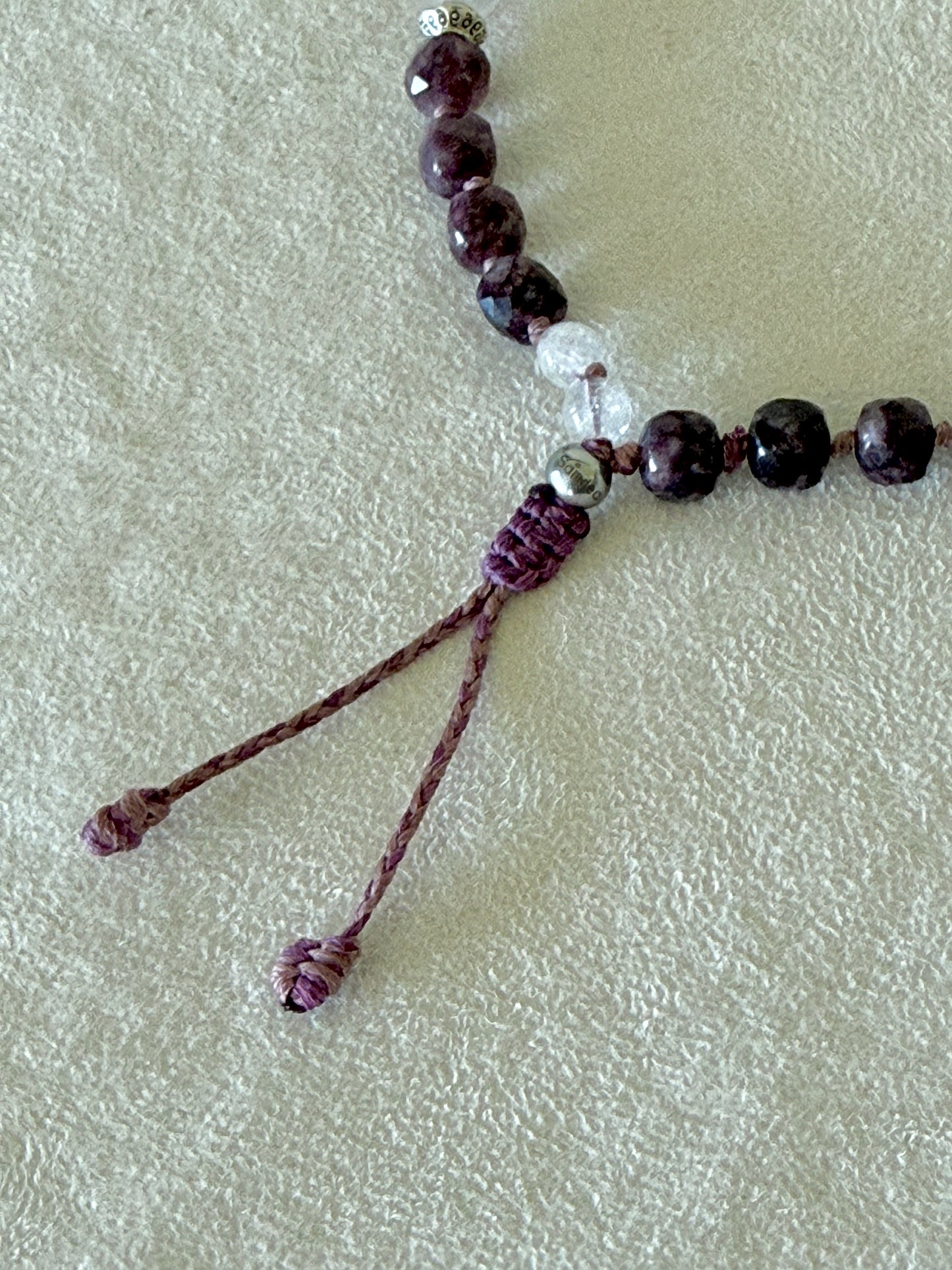 Close-up of the adjustable macramé closure on the Pause Breathing half mala bracelet