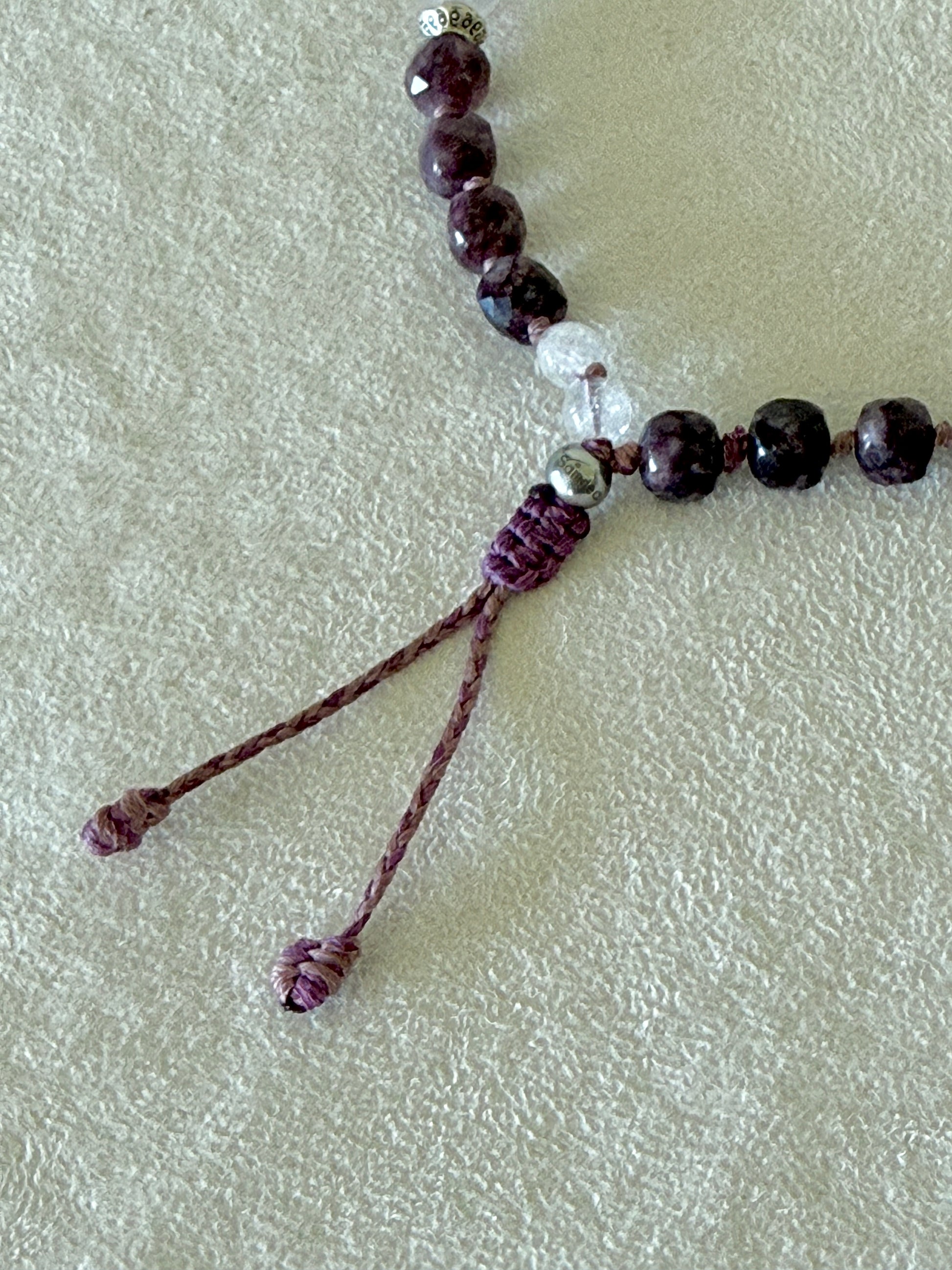 Close-up of the adjustable macramé closure on the Pause Breathing half mala bracelet