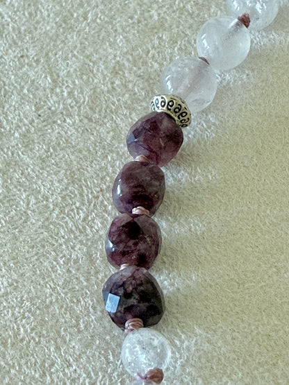 Close-up of garnet, clear quartz, and rose quartz beads on the Pause Breathing half mala bracelet