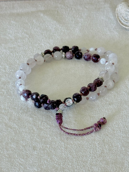 Pause Breathing Mala bracelet with garnet, clear quartz, and rose quartz beads and adjustable cord closure