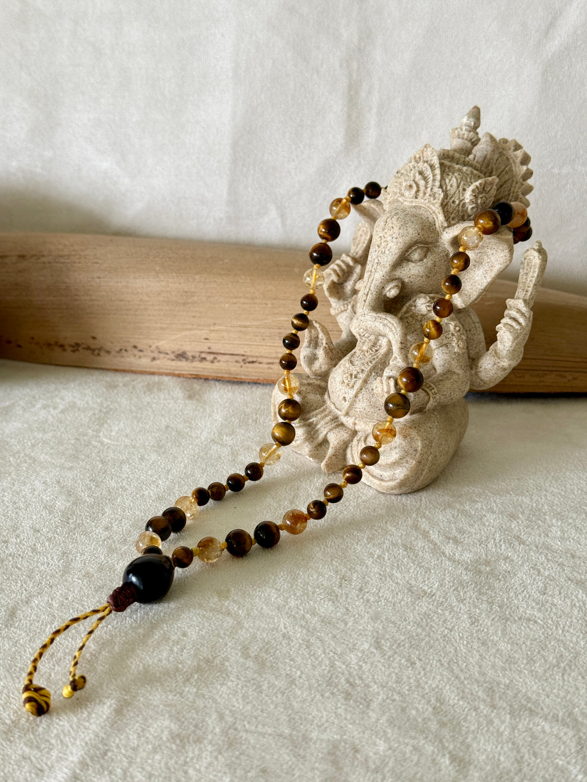 Handmade Box Breathing Mala with tiger's eye and citrine, featuring a natural soap-berry seed meru, designed for box breathing, meditation, and a return to your own center.