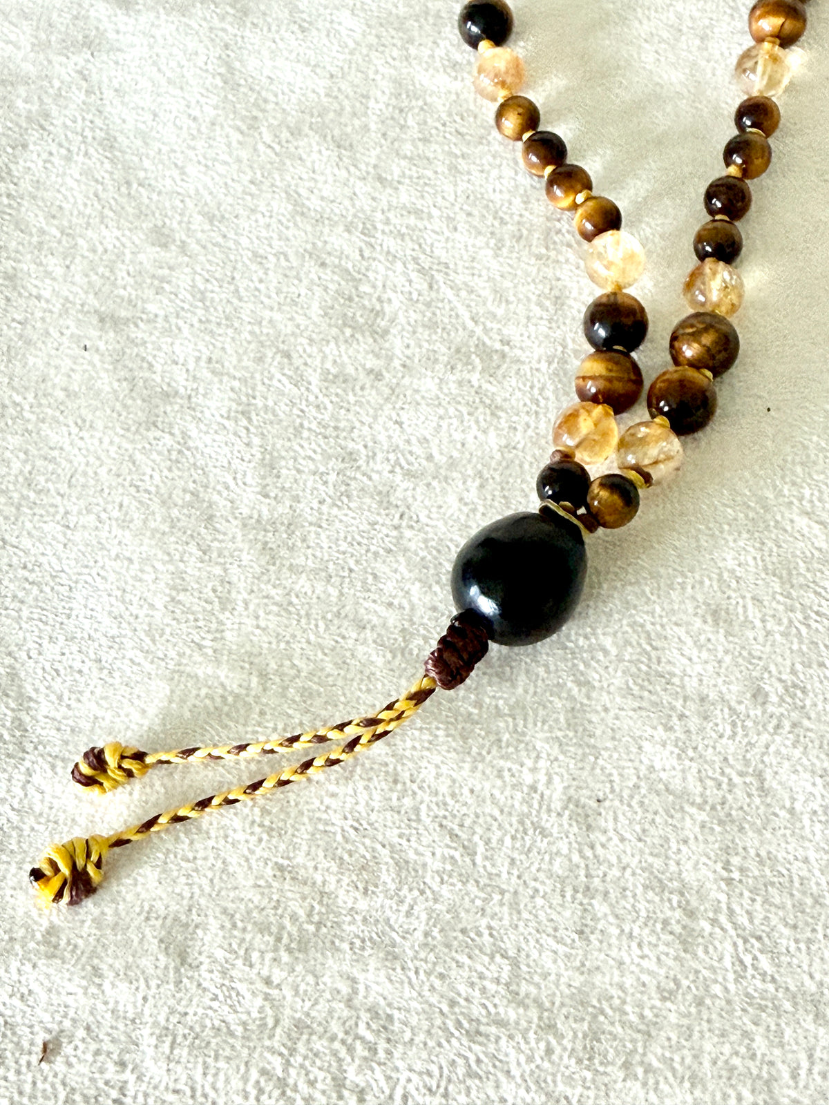 Handmade Box Breathing Mala with tiger's eye and citrine, featuring a natural soap-berry seed meru, designed for box breathing, meditation, and a return to your own center.