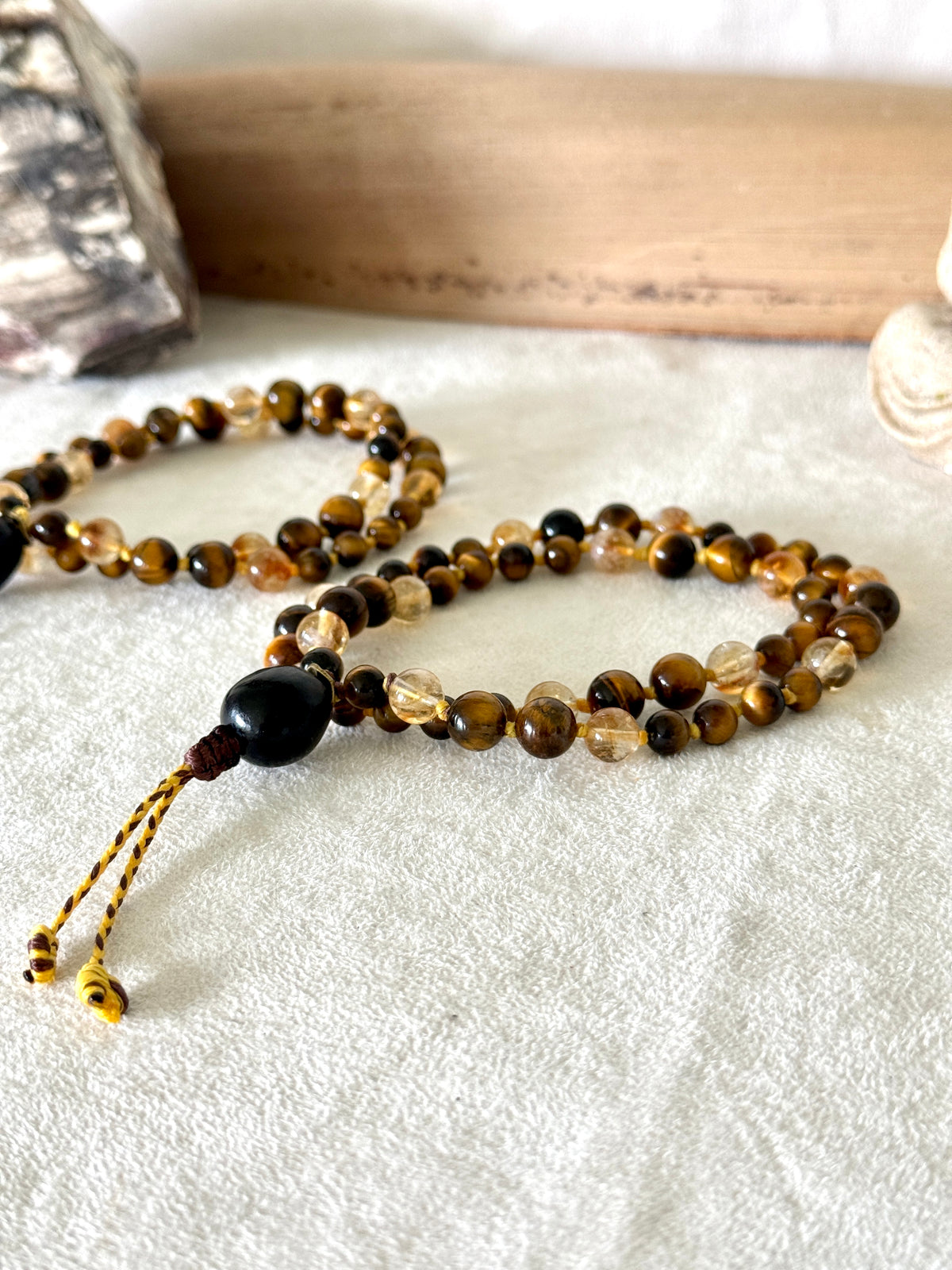 Handmade Box Breathing Mala with tiger's eye and citrine, featuring a natural soap-berry seed meru, designed for box breathing, meditation, and a return to your own center.