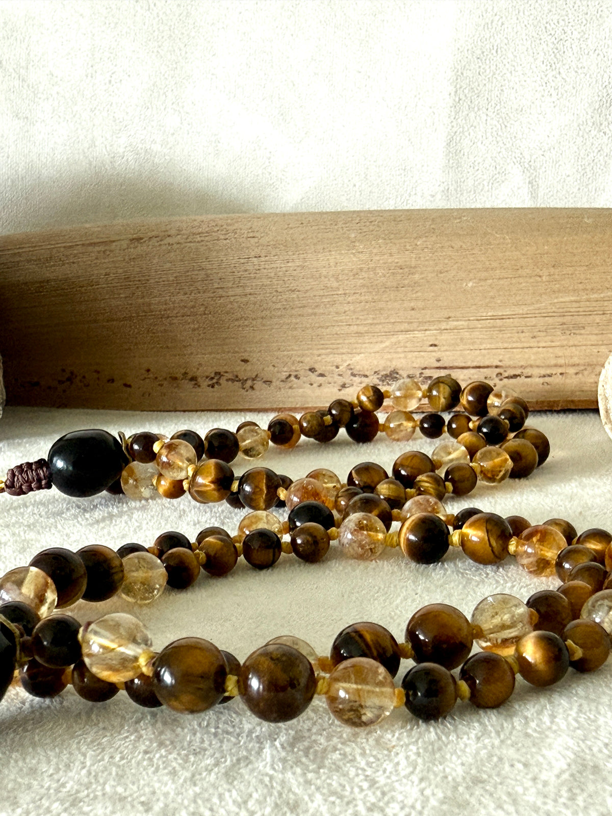 Handmade Box Breathing Mala with tiger's eye and citrine, featuring a natural soap-berry seed meru, designed for box breathing, meditation, and a return to your own center.