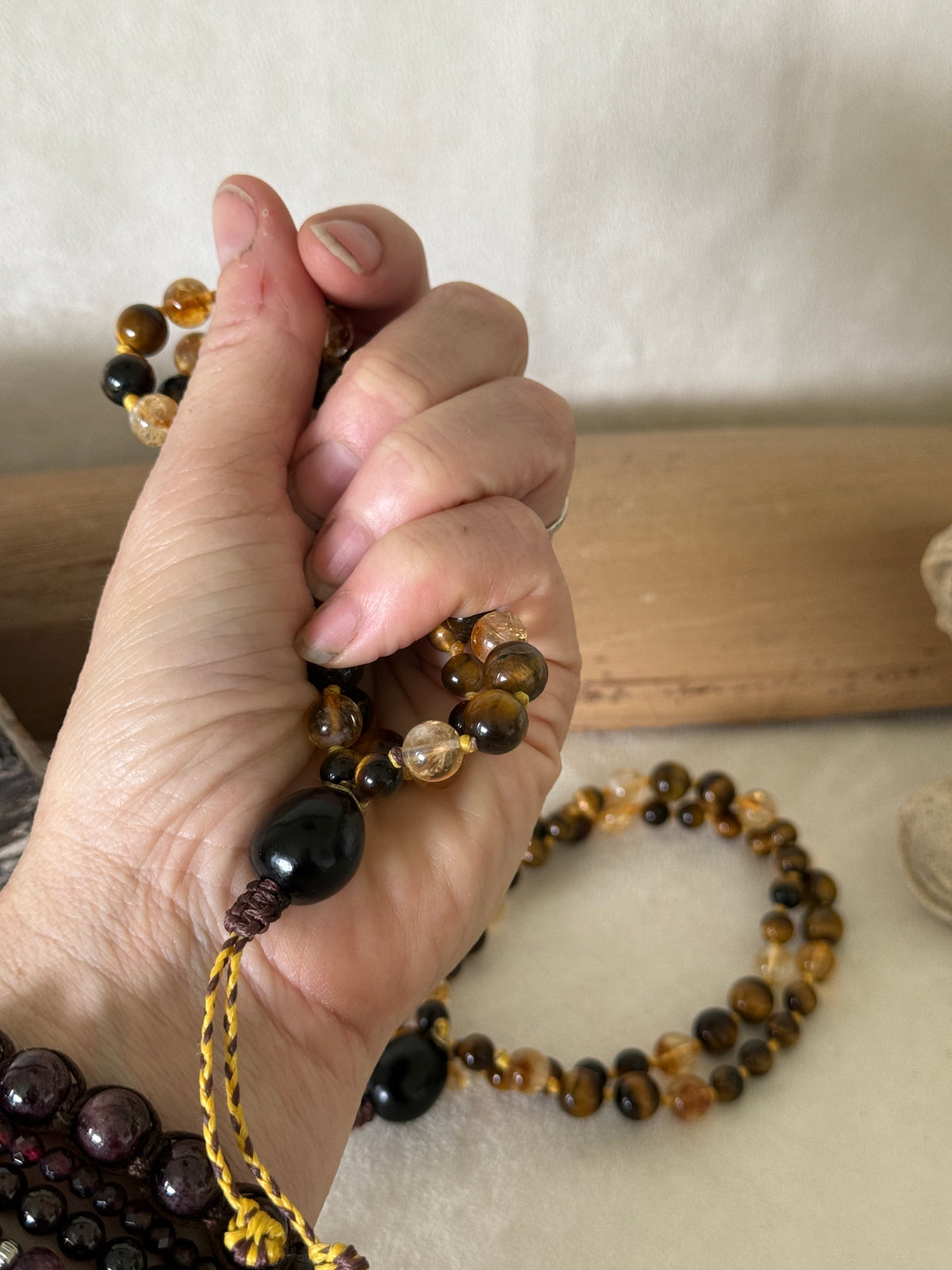 Handmade Box Breathing Mala with tiger's eye and citrine, featuring a natural soap-berry seed meru, designed for box breathing, meditation, and a return to your own center.