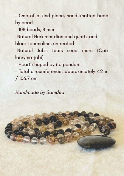Infographic listing the mala's specifications: one-of-a-kind piece, 108 beads, 8mm natural Herkimer diamond quartz and black tourmaline, Job's tears seed meru, heart-shaped pyrite pendant, total length approximately 42 inches