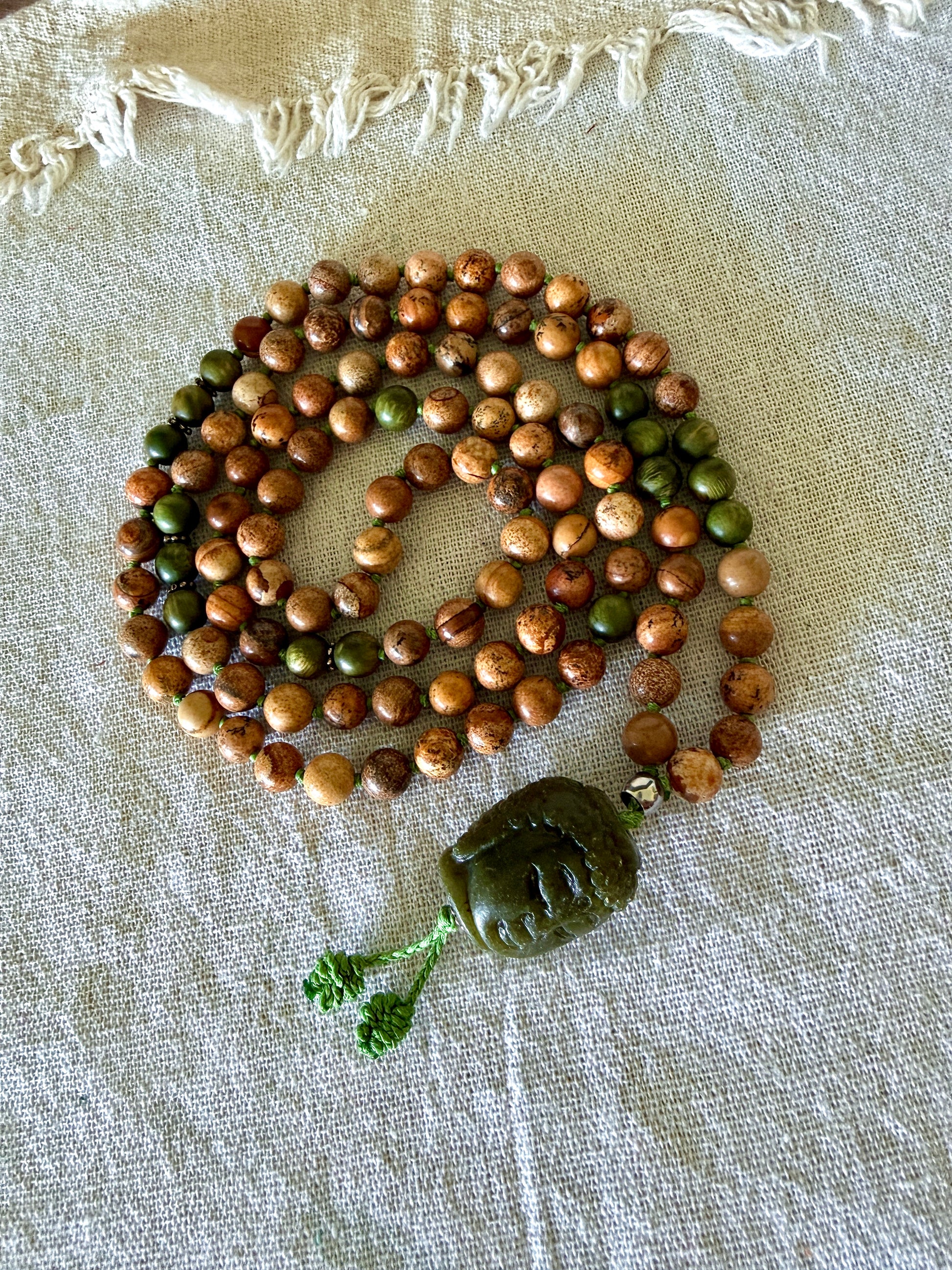 108 bead mala for meditation with genuine sandalwood, sand jasper gemstones, and Jade Buddha pendant