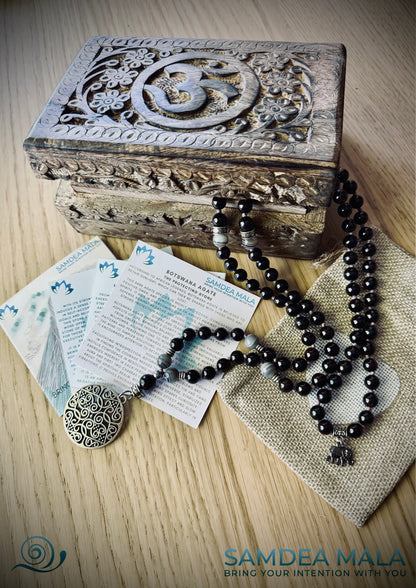 Packaging Samdea Mala Guru Mala beads with carved wood spiritual jewelry box