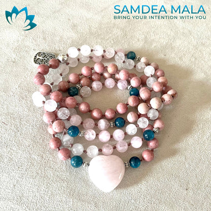 Personalized mala handcrafted with natural stones: rose quartz, rhodonite, and apatite. Designed for meditation, love, and compassion. Features a small Tree of Life charm.