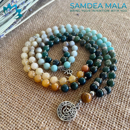 Samdea Mala custom mala personalized gemstones. Ma multicolor mala in green agate, amazonite and jade with om pendant and small charm