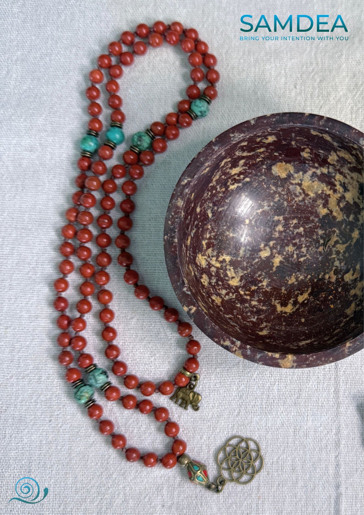 Mala necklace with Red Jasper and African Turquoise, hand-knotted with 108 beads for meditation and personal growth. Spiritual jewelry for grounding, strength, and transformation. Soapstone bowl.