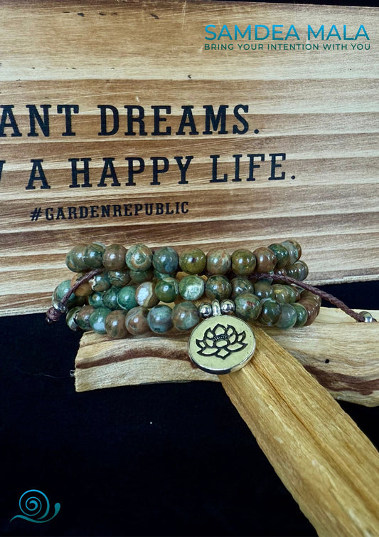 Samdea Mala – Rhyolite jasper wrap bracelet with lotus charm, reen and brown forest rhyolite for purity and transformation. Jewelry for grounding and spiritual reflection