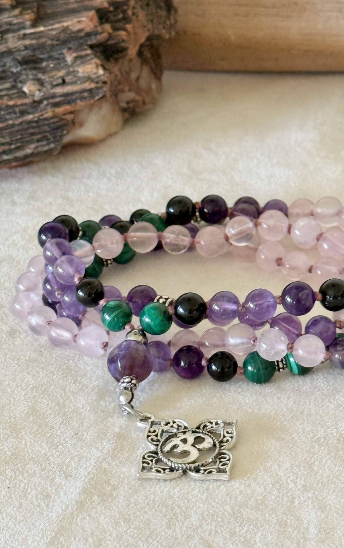 Samdea Mala custom mala personalized gemstones. Multicolor mala in amethyst, rose quartz and malachite, om pendant