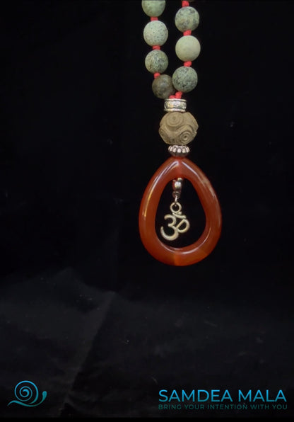 108 mala necklace with grounding Pendant with OM on a spiritual mala beads with turquoise and red gemstone beads. Handmade in US mala for meditation and intention setting.