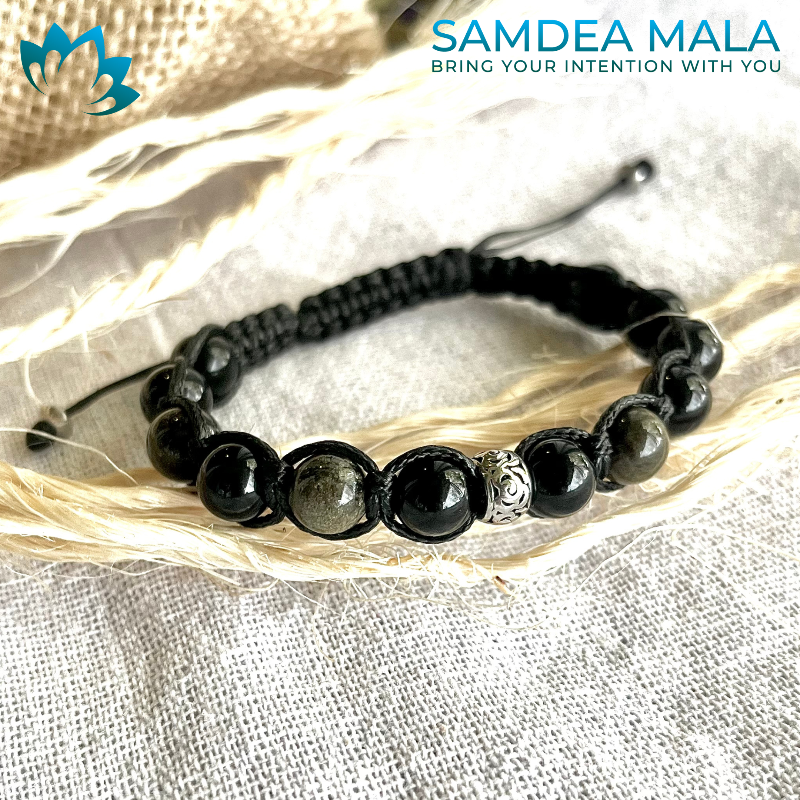 Samdea Mala Tibetan bracelet in obsidian, featuring black and gold beads on black cord.  The bracelet has a silver accent bead. Meditation bracelet, for mindfull growth, Grounding, Protection & Energetic Clarity