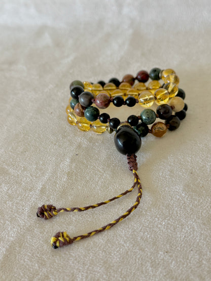 Handmade adjustable Pause Breathing Mala with natural gemstone beads, designed to guide a 4–2–6 breathing practice through touch without the need to count.