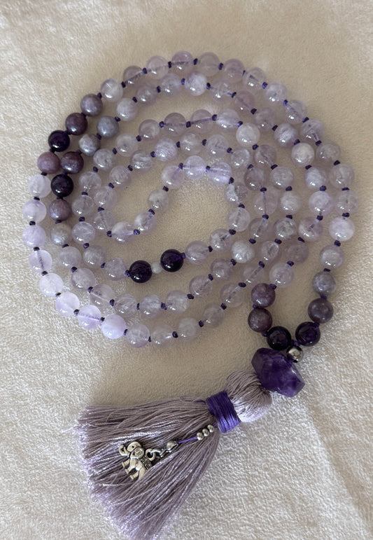 Purple lavender mala necklace for meditation. Handmade 108 bead mala in natural gemstone 8 mm lavender jade, lepidolite and amethyst with cotton tassel and small elephant charm.