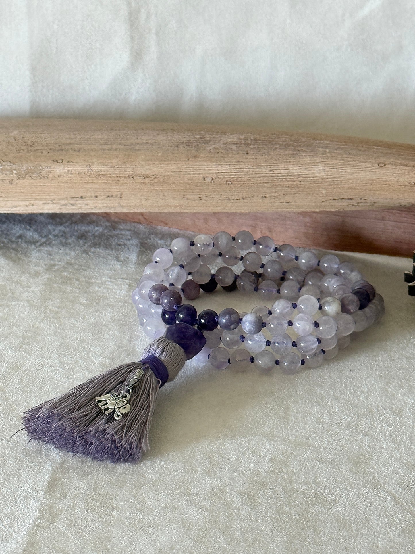 Purple mala necklace for meditation Handmade 108 bead mala in netural gemstone 8 mm lavender jade, lepidolite and amethyst with cotton tassel and small elephant charm.
