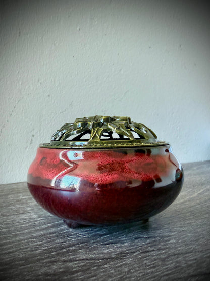 Red ceramic vessel with a polished brass decorative lid, 3 inches diameter, shown as a home decor accessory.
