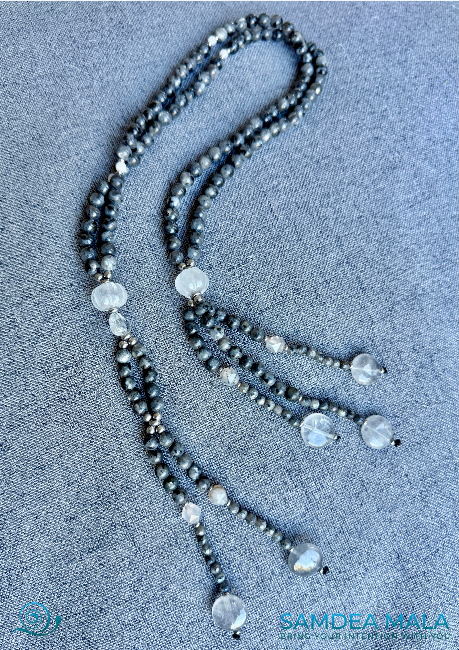 Full view of SGI juzu with tassels, larvikite, labradorite, and quartz